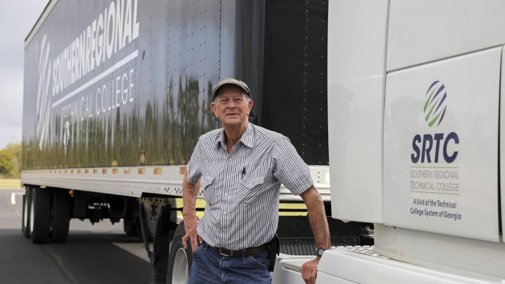 Bill Nichols stands in front of an 18-wheeler provided by the{&nbsp;}Southern Regional Technical College in Georgia. (Photo:{&nbsp;}Southern Regional Technical College){p}{/p}