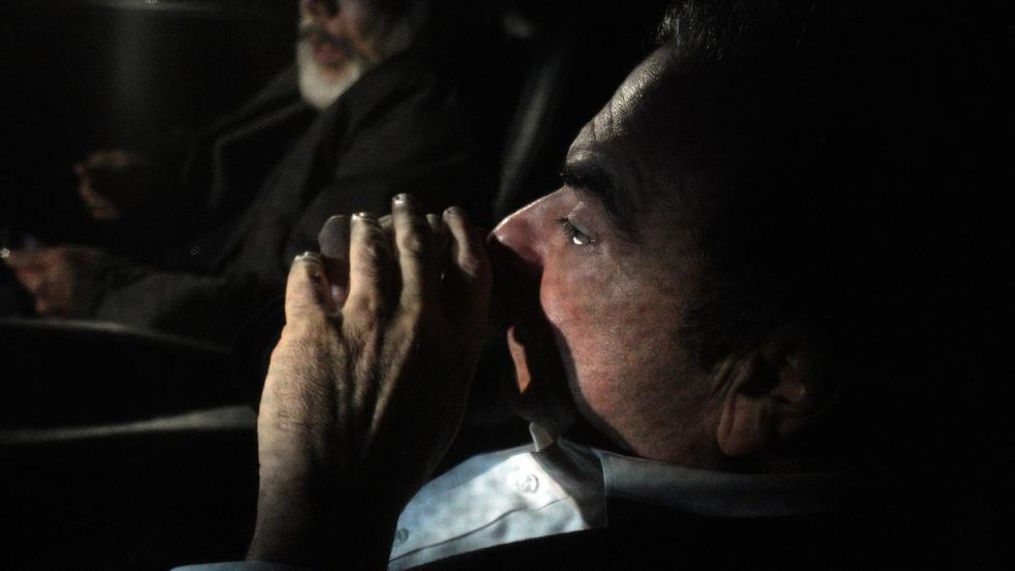 Former Nissan chairman Carlos Ghosn, front, travels in a car Wednesday, March 6, 2019, in Tokyo, after posting 1 billion yen ($8.9 million) in bail once an appeal by prosecutors against his release was rejected. Ghosn was arrested in November and is charged with falsifying financial reports and breach of trust. (AP Photo/Eugene Hoshiko)