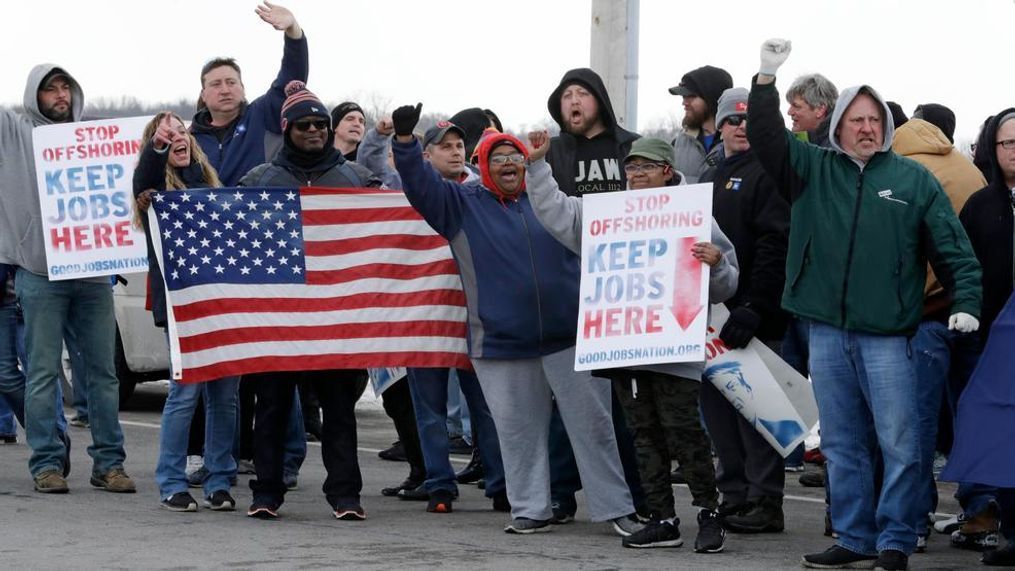 General Motors employees gather outside the plant for a protest, Wednesday, March 6, 2019, in Lordstown, Ohio. General Motors' sprawling Lordstown assembly plant near Youngstown is ending production of the Chevrolet Cruze sedan, ending for now more than 50 years of auto manufacturing at the site. (AP Photo/Tony Dejak)