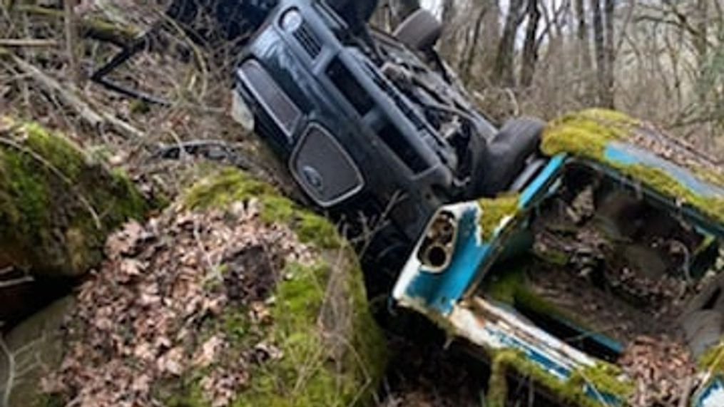 {p}Firefighters responded to a report of a car crash Sunday - and found the wreckage piling up. "What makes this crash peculiar," the Jacksonville Fire Department said in a Facebook post, "is that it landed right next to the car that has been down there for quite some time growing moss on it." (Photo: Jacksonville Fire Department){/p}