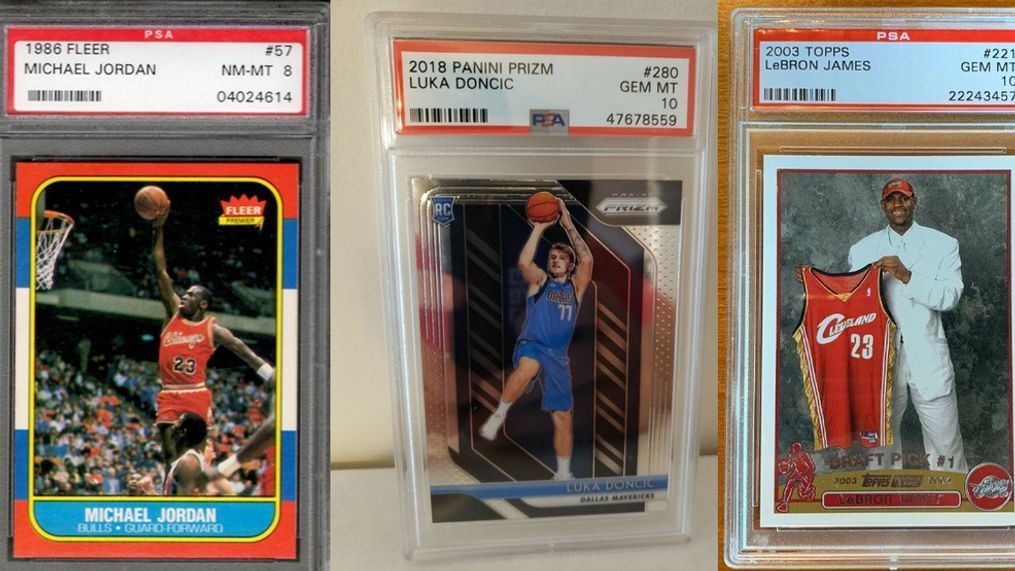 Sports trading cards are experiencing the strongest surge in their history. A{&nbsp;}Michael Jordan 1986 Fleer Rookie in PSA 8,{&nbsp;}Luka Doncic 2018 Panini Prizm rookie PSA 10, and{&nbsp;}Mike Trout 2011 Topps Update are pictured in this October 5, 2020 file photo.{&nbsp;} (Image: ABC7)