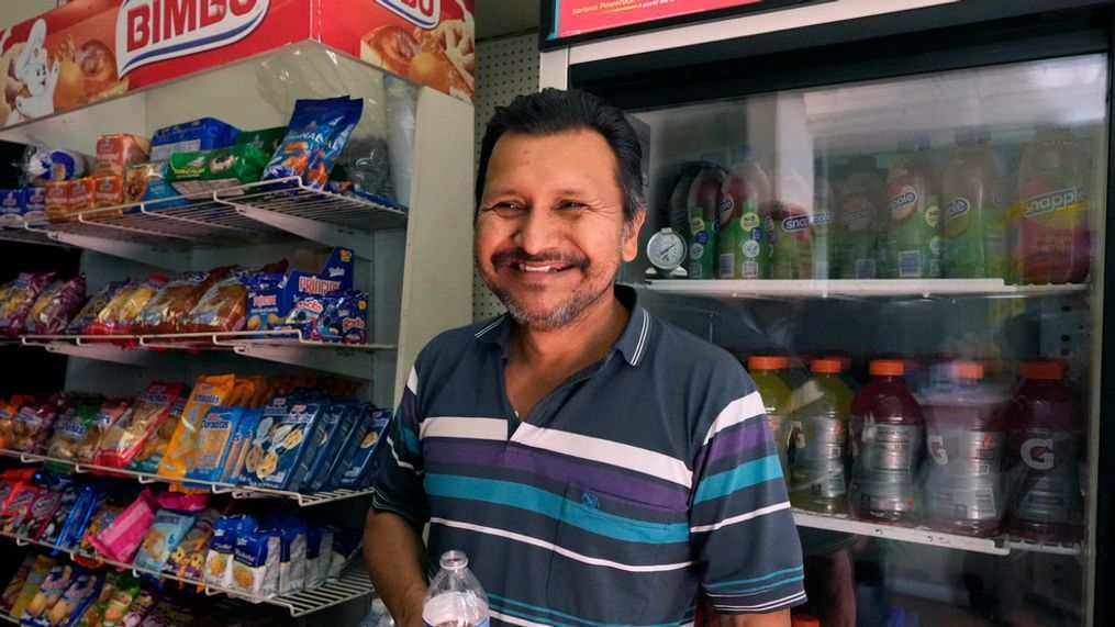 Navor Herrera stands inside the Las Palmitas Mini Market where the winning lottery ticket was sold in downtown Los Angeles, Thursday, July 20, 2023. (AP Photo/Marcio Jose Sanchez)