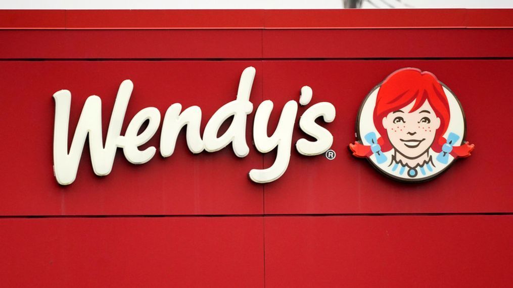 FILE - The Wendy's sign is seen at a restaurant, Jan. 23, 2023, in Pittsburgh. Wendy's is looking to test having the prices of its menu items fluctuate throughout the day based on demand, implementing a strategy that has already taken hold with ride-sharing companies and ticket sellers. (AP Photo/Gene J. Puskar, File)