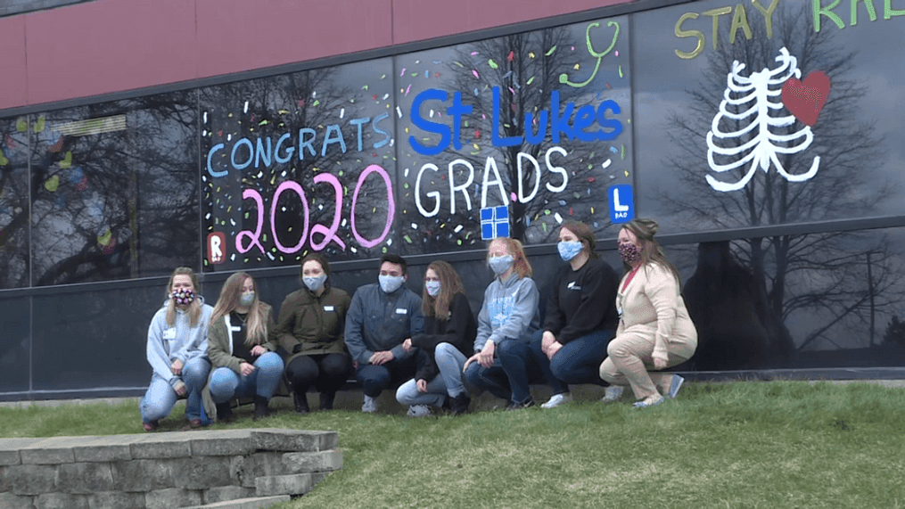 Students at St. Luke's College of Nursing, along with faculty and staff, spent part of their day decorating and painting windows on the college building. (Siouxland News)