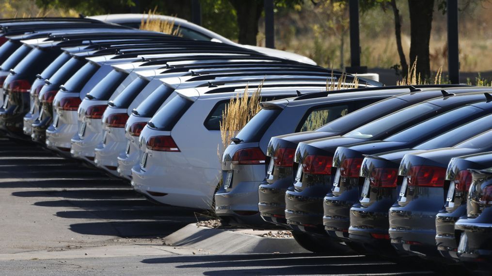 In this Thursday, Sept. 24, 2015, photo, Volkswagen cars for sale are on display on the lot of a dealership in Boulder, Colo. General Motors and Ford each posted strong U.S. sales in September 2017, confirming predictions that the industry could rebound for the month. (AP Photo/Brennan Linsley)