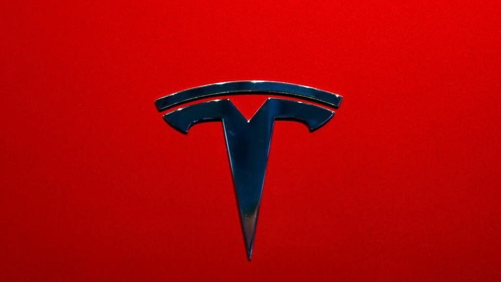 This file photo shows the logo of Tesla Model 3 at the Auto show in Paris. U.S. securities investigators have subpoenaed information from Tesla about production forecasts for the Model 3 electric car that were made last year, the company acknowledged in a regulatory filing Friday, Nov. 2. The disclosure in Tesla’s quarterly financial report also says the Securities and Exchange Commission subpoena covered other public statements made about Model 3 production. The filing also says Tesla is cooperating with a Justice Department request for information about production. (AP Photo/Christophe Ena, File)