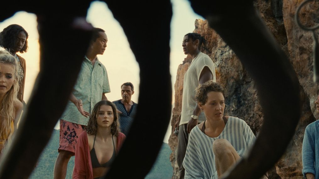 (from left) Chrystal (Abbey Lee), Patricia (Nikki Amuka-Bird), Jarin (Ken Leung), Maddox (Thomasin McKenzie), Charles (Rufus Sewell), Mid-Sized Sedan (Aaron Pierre), Prisca (Vicky Krieps) and Guy (Gael García Bernal) in Old, written for the screen and directed by M. Night Shyamalan.