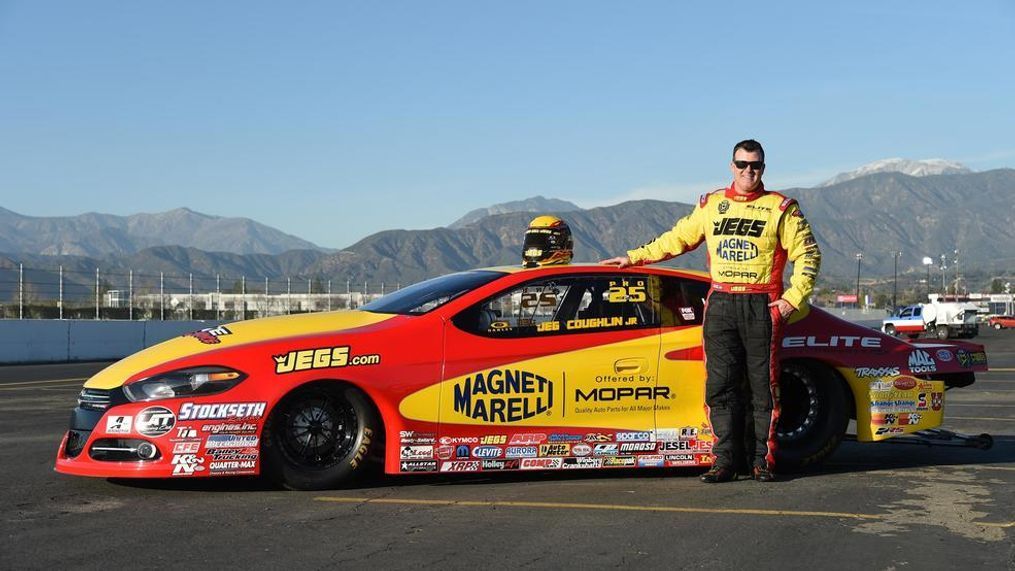 In this March 2016 photo,{&nbsp;}Jeg Coughlin Jr. poses with the “Magneti Marelli Offered by Mopar” Dodge Dart GT.{&nbsp;} Fiat Chrysler Automobiles{&nbsp;} announced the sale of Magneti Marelli, its auto components division, to a Japanese automotive component supplier in a deal valued at $7 billion. (Image courtesy of Fiat Chrysler Automobiles)