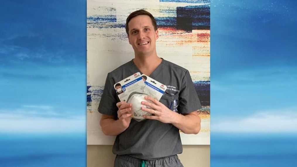 Brandon Giberson poses with the masks his second-grade teacher sent to Mid Coast Hospital in Brunswick, Maine. (Photo: Brandon Giberson)