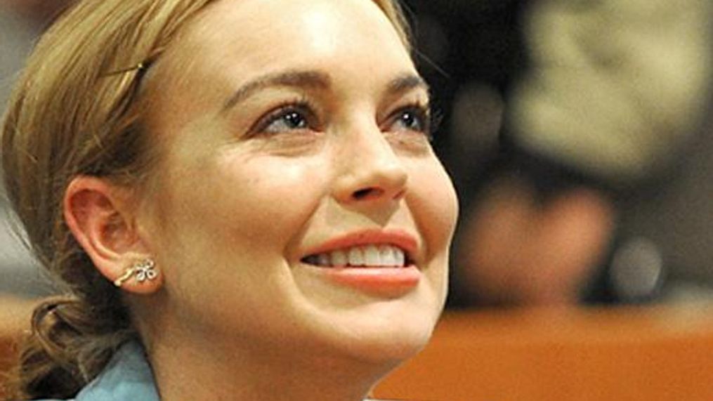 Lindsay Lohan smiles during a progress report on her probation for theft charges at Los Angeles Superior Court Thursday, March 29, 2012. A judge ended Lindsay Lohan's supervised probation on Thursday, giving the actress her freedom after nearly two years of constant court hearings and threats of jail. Lohan thanked Superior Court Judge Stephanie Sautner for her patience and let out a sigh of relief as she exited the courtroom after the brief hearing. (AP Photo/Joe Klamar, Pool)