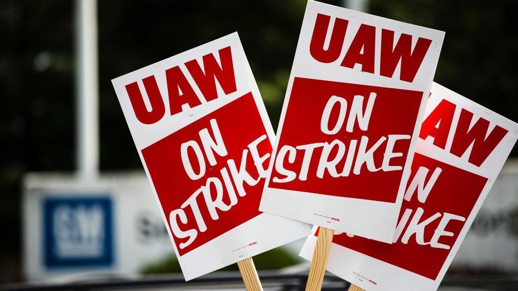 FILE - In this Sept. 16, 2019, file photo signs are posted during a demonstration outside a General Motors facility in Langhorne, Pa. Now that the United Auto Workers union has settled with General Motors after a nearly six-week strike, the union will focus on Ford and then Fiat Chrysler. But neither of the companies is going to want the same terms as GM agreed to, making one or two more strikes possible. (AP Photo/Matt Rourke, File)