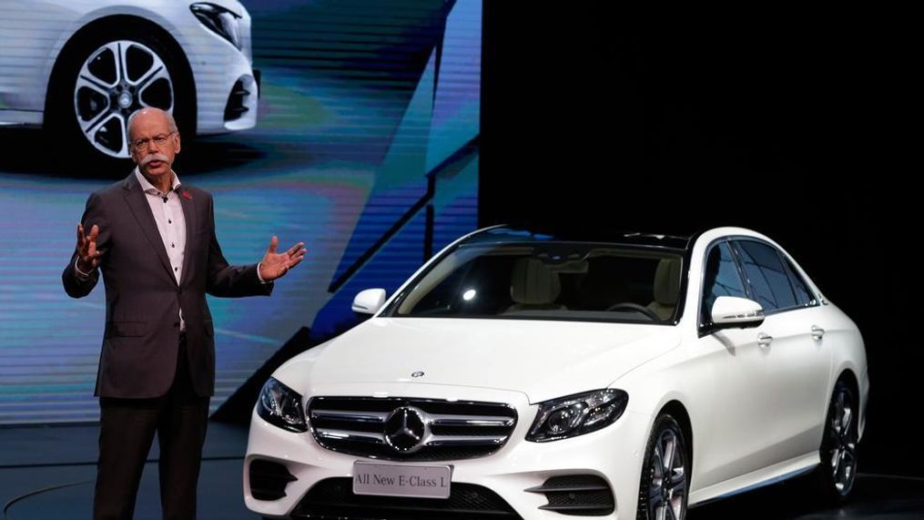 FILE - In this Sunday, April 24, 2016 file photo Dieter Zetsche, CEO of the Daimler AG speaks next to the new Mercedes Benz E-Class Long Wheelbase during the world premiere ahead of the Auto China 2016 exhibition in Beijing, China. German carmaker Daimler endured a weak start to the year, echoing troubles at other major manufacturers, as sales in the big Chinese market stuttered (AP Photo/Andy Wong, file)