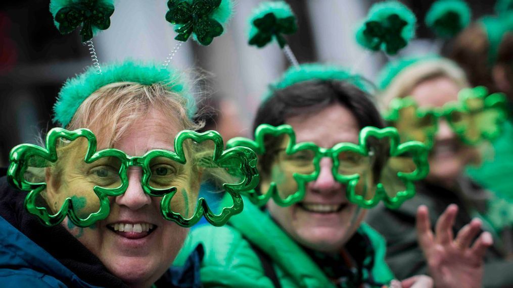 FILE - This file photo from Saturday March 16, 2019, shows Sharon Keely, left, of Dublin, viewing the St. Patrick's Day Parade along Fifth Avenue in New York. (AP Photo/Mary Altaffer, File)