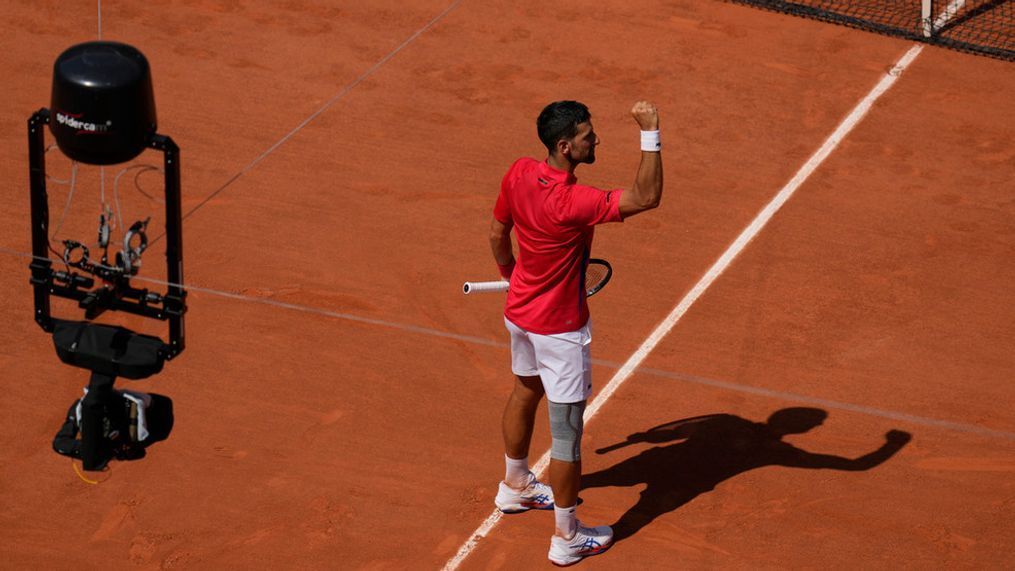 Serbia's Novak Djokovic celebrates after defeating Spain's Rafael Nadal in their men's singles second round match at the Roland Garros stadium at the 2024 Summer Olympics, Monday, July 29, 2024, in Paris, France. Novak Djokovic dominated rival Rafael Nadal to win 6-1, 6-4 at the Paris Olympics in the second round. (AP Photo/Manu Fernandez)