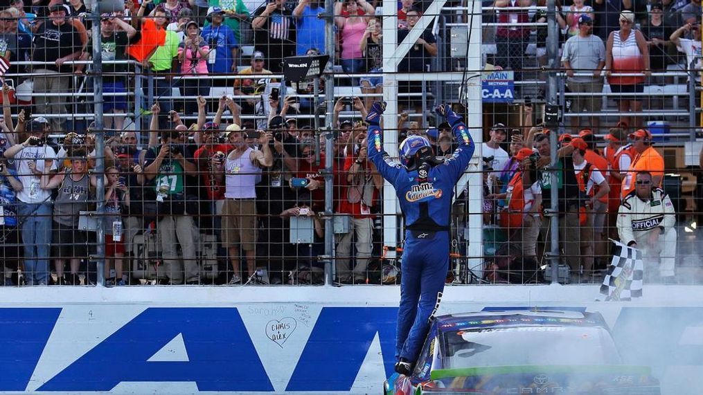 Kyle Busch raises his arms towards fans after winning the NASCAR Cup Series 300 auto race at New Hampshire Motor Speedway in Loudon, N.H., Sunday, Sept. 24, 2017. (AP Photo/Charles Krupa)