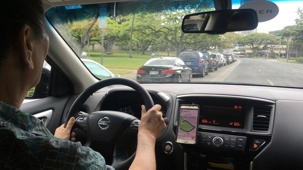 Uber driver Joshua Oh drives in Honolulu on Wednesday, June 6, 2018. Honolulu's city council is scheduled to vote on a bill that won't allow ride-hailing services to impose so-called "surge pricing" on riders if the fee is higher than a maximum amount set by the city. The bill says the city would set a maximum fare private transportation companies may charge. That would prevent surge prices that are higher than the city-set limit. (AP Photo/Jennifer Sinco Kelleher)