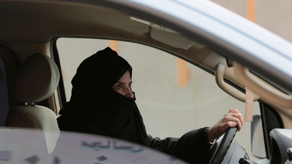 In this Saturday, March 29, 2014, file photo, Aziza Yousef drives a car on a highway in Riyadh, Saudi Arabia, as part of a campaign to defy Saudi Arabia's ban on women driving.  Saudi Arabia says it will allow women to drive for the first time in the ultra-conservative kingdom. The kingdom, which announced the change on Tuesday, Sept. 26, 2017, was the only the country in the world to bar women from driving and for years had garnered negative publicity internationally for detaining women who defied the ban. (AP Photo/Hasan Jamali, File)