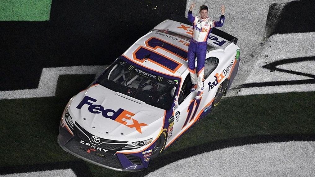 Denny Hamlin (11) celebrates after winning the NASCAR Daytona 500 auto race at Daytona International Speedway Sunday, Feb. 17, 2019, in Daytona Beach, Fla. (AP Photo/Phelan M. Ebenhack)