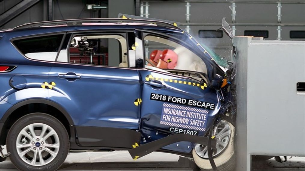 Action shot taken of the 2018 Ford Escape during the IIHS passenger-side small overlap frontal crash test. (Image courtesy of the Insurance Institute for Highway Safety)