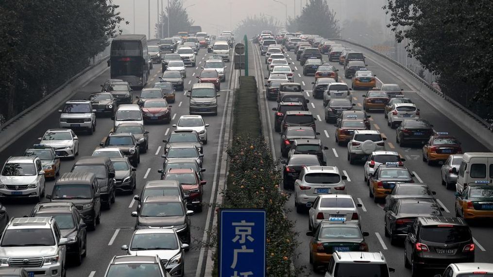 In this 2017 file photo, motorists are clogged with heavy traffic on a city ring road in Beijing. An industry group, the China Association of Automobile Manufacturers, said Friday, Feb. 9, 2018 sales of sedans, SUVs and minivans rose 10.7 percent from a year earlier to 2.4 million. Total vehicle sales including trucks and buses rose 13.6 percent to 2.7 million. (AP Photo/Andy Wong, File){&nbsp;}{p}{/p}