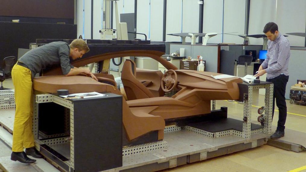 Aaron Stich and John McDougall, creative designers for Buick, review how the clay sculptors brought the Buick Avista Concept to life. (Image courtesy of General Motors)