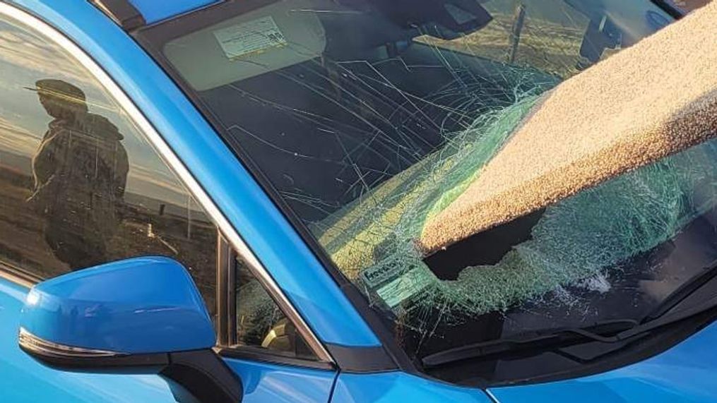 A driver dodged death after unsecured wood flew through her windshield on Hwy. 145 in Madera, California. (Photo: Crystal Christman via KMPH)