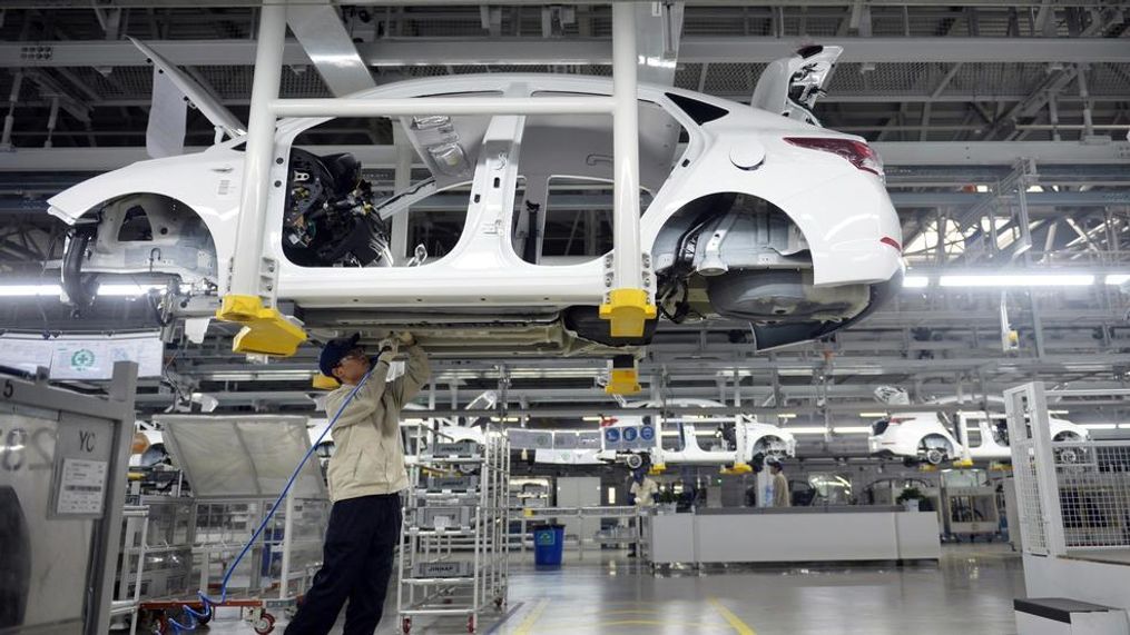 In this Feb. 21, 2017, photo, a staff member works on an assembly line at a Beijing Hyundai Motor auto plant in Cangzhou in northern China's Hebei province. An industry group says China's auto sales shrank in December and ended 2017 up just 1.4 percent over the previous year as the popularity of SUVs helped to offset contraction in demand for sedans. (Chinatopix via AP)