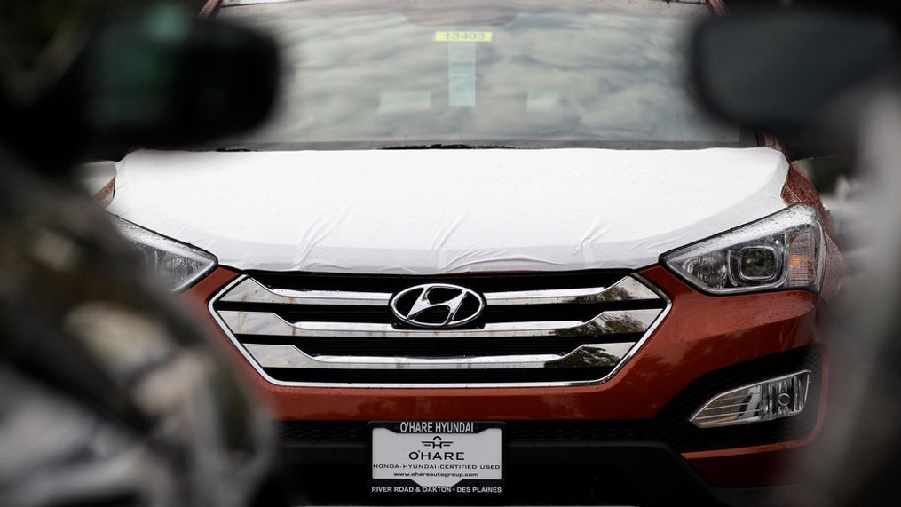 This Oct. 4, 2012, file photo shows a Hyundai Sonata at a Hyundai car dealership in Des Plaines, Ill.  The U.S. government’s highway safety agency said Monday, April 1, 2019, that it has decided to open two new investigations into fires involving Hyundai and Kia vehicles. The investigations cover non-crash fires in almost 3 million vehicles from the affiliated Korean automakers. The probes cover the 2011 through 2014 Hyundai Sonata and Santa Fe, the 2011 through 2014 Kia Optima and Sorento, and the 2010 through 2015 Kia Soul. (AP Photo/Nam Y. Huh, File)