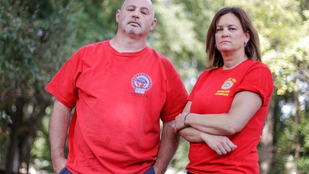 This Sept. 20, 2019, photo, shows General Motors workers Matt Himes and Tammy Hudak in Spring Hill, Tenn. Both Himes and Hudak grew up in the shadow of the 6-million-square-foot GM plant in Lordstown, Ohio, and went to work there. Now they are among those who uprooted to work at GM's facility in Spring Hill, Tenn. (AP Photo/Mark Humphrey)