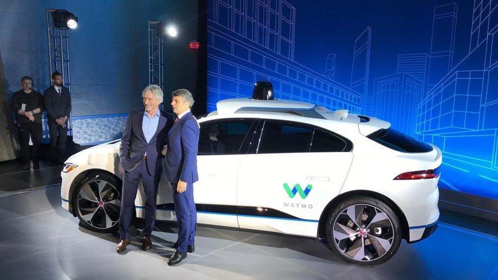 John Krafcik, Waymo CEO, and Ralf Speth, Jaguar Land Rover CEO, announce that the Jaguar I-Pace will join the Waymo fleet as the first all-electric, self-driving luxury SUV. (Sinclair Broadcast Group / Jill Ciminillo)