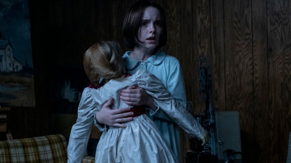 MCKENNA GRACE as Judy Warren with the Annabelle doll in New Line Cinema’s horror film “ANNABELLE COMES HOME,” a Warner Bros. Pictures release. (Photo: Warner Bros.)