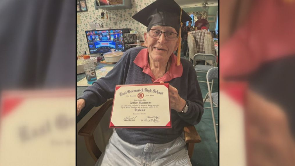 Arthur Masterson holding up his high school diploma. (Masterson Family)