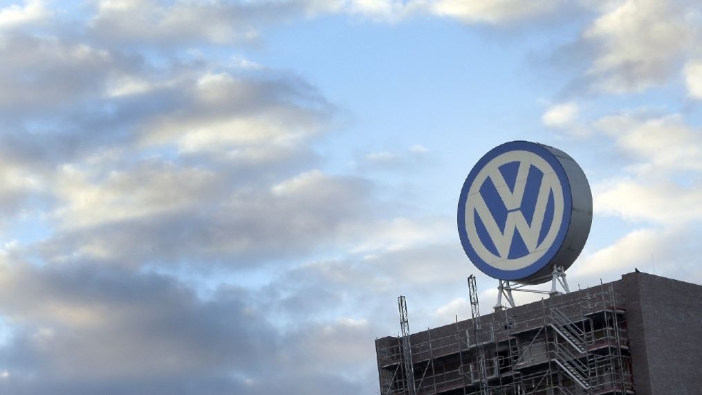 A giant logo of the German car manufacturer Volkswagen is pictured on top of a company's factory building in Wolfsburg, Germany. Volkswagen says it has reached an agreement with two suppliers in a dispute that forced the company to suspend production of some models in Germany. News agency dpa reported Tuesday Aug. 23, 2016  that the automaker said the suppliers will quickly resume deliveries. No details were released.   (AP Photo/Michael Sohn, file)