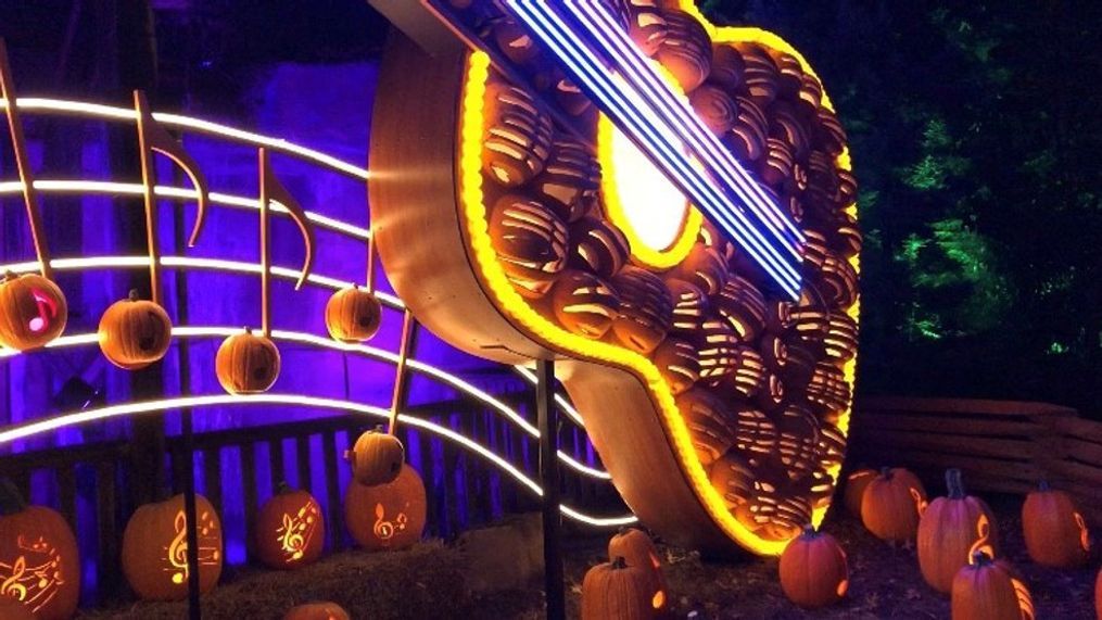 Thousands of jack-o-lanterns create fun displays like the massive glowing guitar, the pumpkin tree, sunflowers, and the frogs at Drop Line Pond for Pumpkin LumiNights. (FOX 17 News photo){p}{/p}