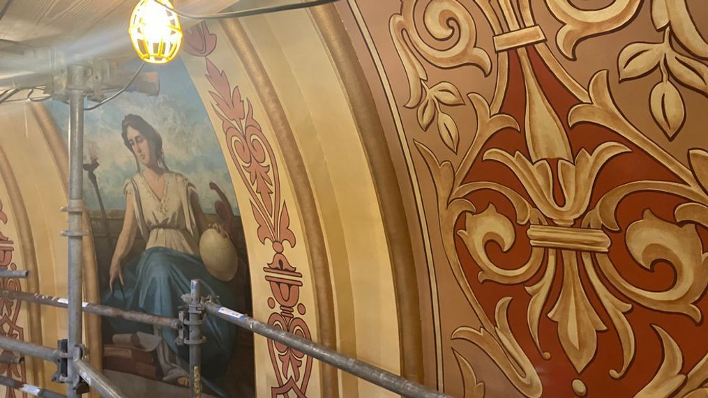 A painting of one of 8 muses inspired by Grecian and Roman mythology can be found in the oculus of Michigan State Capitol Building's Rotunda on April 4, 2024. Restoration work, which comes about every 40 years or so, is almost complete. (James Prince/WWMT)