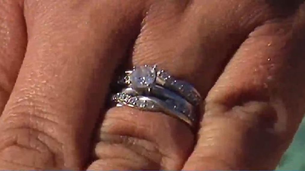 A West Michigan man, John Dudley, helped Jamie Kennedy reunite with her wedding ring after she lost it in Lake Michigan. (WWMT)