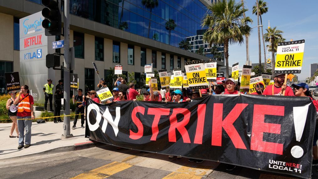 Striking Hotel workers from Unite Here Local 11 join the picketing actors of SAG-AFTRA, and writers of the WGA, outside Netflix studios on July 21, 2023, in Los Angeles. (AP Photo/Chris Pizzello, File)