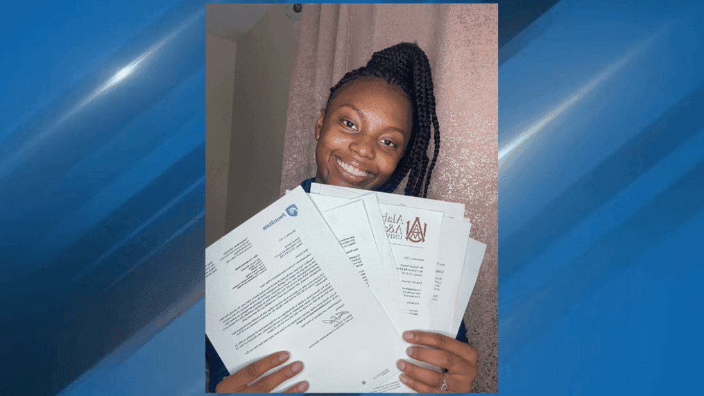 Kenyari Sawyer poses with some of her acceptance letters from more than 40 colleges across the United States. (Photo: Kenyari Sawyer)