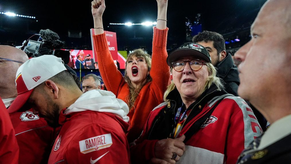 Taylor Swift, left, and Donna Kelce watch the Kansas City Chiefs receive the Lamar Hunt trophey after an AFC Championship NFL football game between the Baltimore Ravens and the Kansas City Chiefs, Sunday, Jan. 28, 2024, in Baltimore. (AP Photo/Julio Cortez)