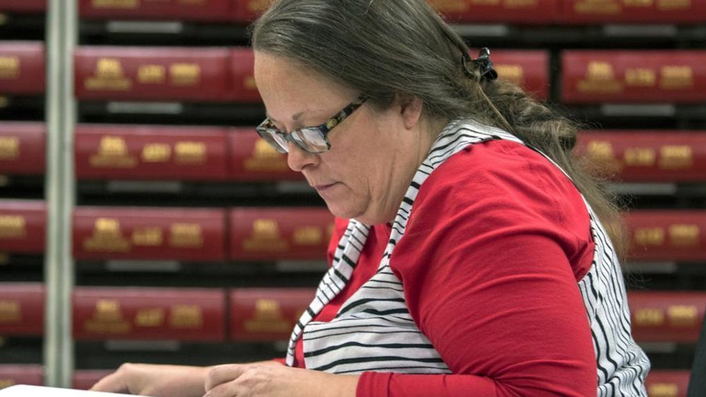 FILE - In this Nov. 6, 2018, file photo, Kim Davis, the county clerk for Rowan County in Kentucky, works with the county election board on Election Day, in Morehead, Ky. A federal judge has ruled, Friday, March 18, 2022, that the former Kentucky clerk violated the constitutional rights of two same-sex couples after she wouldn't issue them marriage licenses — a refusal that sparked international attention and briefly landed her in jail in 2015. (AP Photo/John Flavell, File)