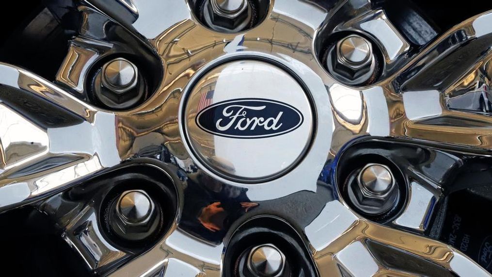 FILE- In this Feb. 14, 2019, file photo a wheel on a 2019 Ford Expedition 4x4 is displayed at the 2019 Pittsburgh International Auto Show in Pittsburgh. Members of the United Auto Workers union at Ford Motor Co. have voted to approve a new contract with the company. The union says in a statement Friday, Nov. 15, 2019,  that 56.3% of workers who voted were in favor of the deal. (AP Photo/Gene J. Puskar, File)