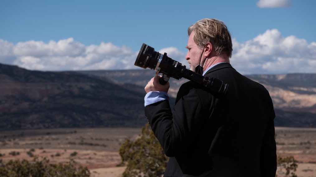 Writer, director, and producer Christopher Nolan on the set of OPPENHEIMER. (Photo: Universal Pictures)