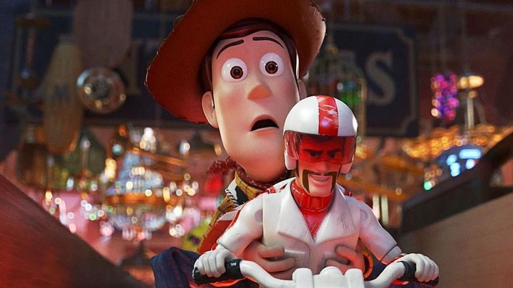 Woody (voiced by Tom Hanks) is taken on a ride by Duke Caboom (Keanu Reeves) in "Toy Story 4."{&nbsp;} (Photo: Disney/Pixar)