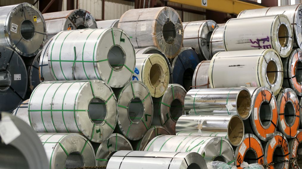 FILE - In this Thursday, July 19, 2018, file photo, rolled steel is seen at Titan Metal Service, Inc.'s facility at the Port of Tampa, Fla. An escalating trade war and steep tariffs on steel and aluminum are putting pressure on earnings for automakers, prompting General Motors to slash its outlook while also weighing down shares of Ford Motor Co. and auto parts companies. (Chris Urso/Tampa Bay Times via AP, File)