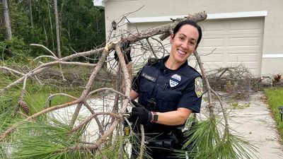 Image for story: Police to the rescue when fallen tree locks family inside their Florida home