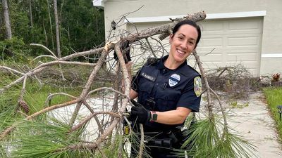 Image for story: Police to the rescue when fallen tree locks family inside their Florida home