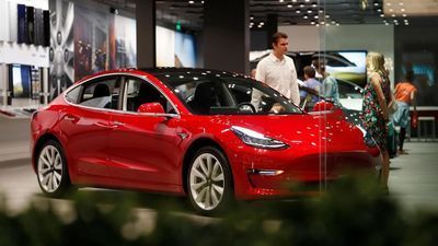 Image for story: Tesla cuts prices as 4Q deliveries miss analysts' estimates