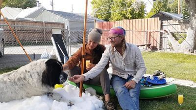 Image for story: Ice center helps dying dog spend final moments in human-made snow