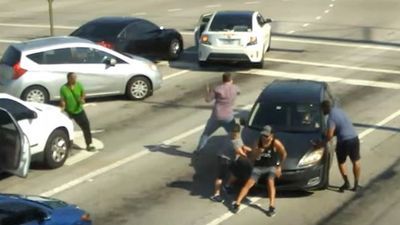 Image for story: Good Samaritans stop moving car to help driver suffering medical emergency