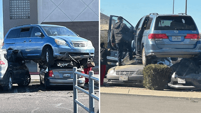 Image for story: How'd it get there? Van causes traffic tie-up in mall parking lot